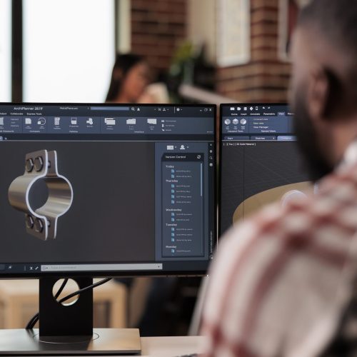 Cad engineer working with manufacturing software to develop industrial machinery and gears model. Engineering technical machine product on computer, construction industry development.